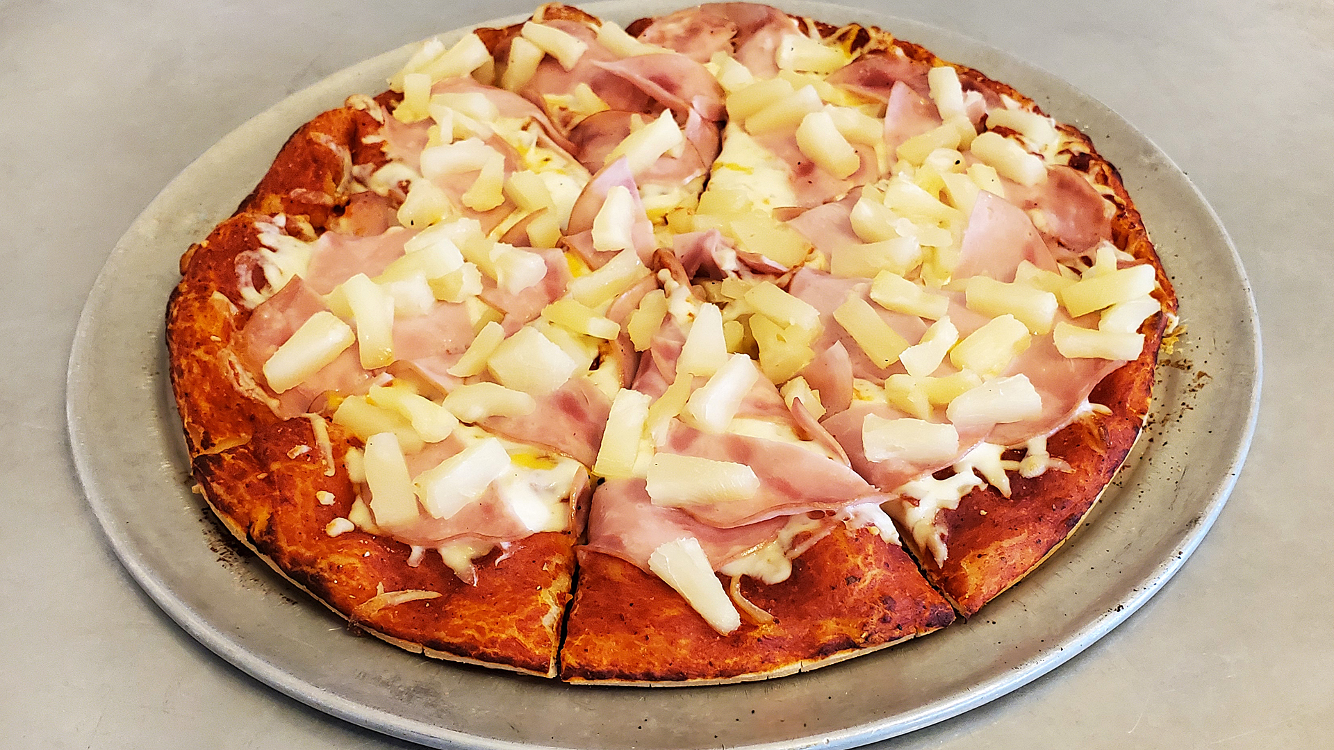 Hawaiian Five-O pizza with Canadian bacon and pineapple
