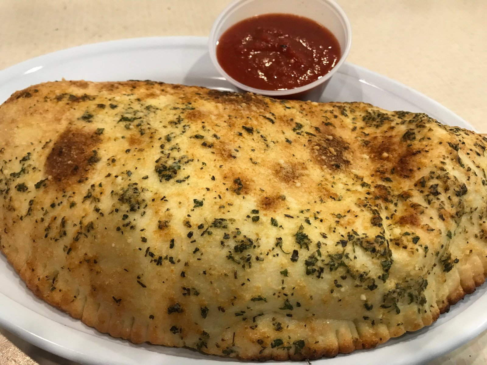 Golden Legends calzone served with marinara